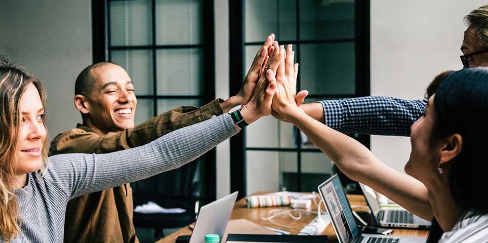 People smiling and working together
